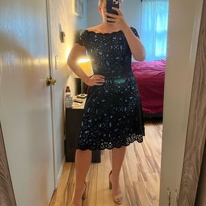 Nue by Shani Laser Cut A line dress black with blue underlay size 12